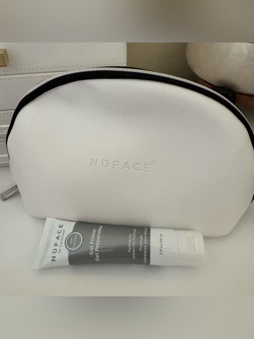 NuFace Cream White Cosmetic Pouch with Embossed Logo